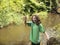 Young Girl Catches Small Trout