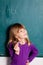 Young girl and chalkboard with letters