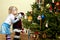 Young girl and Christmas tree