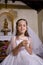 Young girl in church wearing first communion dress