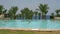 A young girl comes into the swimming pool.