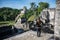 Young Girl Contemplating Mayan Ruins at Tikal, National Park. Tr