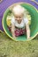 Young Girl Crawling Through Play Equipment