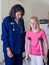 Young girl on crutches with nurse