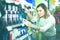 young girl customer looking for effective mouthwash in supermarket