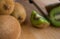 Young girl cutting a kiwi