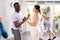 Young girl dancing merengue with African American partner