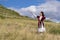 Young girl dancing national dance in an open field