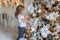 Young girl decorating Christmas tree