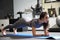 Young girl doing fitness exercises in the gym. Training in the gym for body shaping.