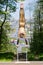 Young girl doing strength gymnastic exercises workout in a beautiful suit outdoors in a park.