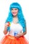 Young girl doll with blue hair. plastic eating a sandwich. hunger