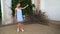 Young girl in dress and peacock posing in Wallenstein Garden in Prague