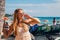 Young girl in a dress walking down the Honolulu Waikiki beach