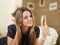 Young girl drinking champagne at home