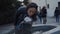 Young girl drinks from a drinking fountain