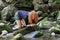 A young girl drinks fresh clear water