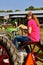 Young girl driving tractor and using cell phone