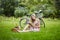 Young girl with eading a book outdoors