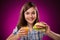 Young girl eating big sandwich