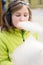 Young girl eating candyfloss.