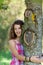 Young Girl Embracing Tree In Park