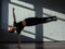 A young girl is engaged in jazz modern dance in the hall.