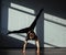 A young girl is engaged in jazz modern dance in the hall.