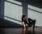 A young girl is engaged in jazz modern dance in the hall.