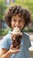 Young girl enjoying ice cream in city park with blurred background, ideal for text placement