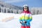 Young girl enjoying skiing on mountain slope