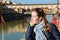 Young girl enjoying the view of Ponte Vecchio in Florence