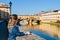 Young girl enjoying the view of Ponte Vecchio in Florence