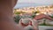 Young girl enjoys her morning cup of coffee with beautiful view of the port city of Kas, Turkey. White cup with coffee