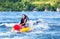 Young girl enjoys tubing on lake