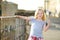 Young girl exploring the famous Pitigliano town, located atop a volcanic tufa ridge. Beautiful italian towns and villages.