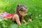 Young girl exploring nature looking at magnifying glass