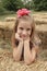 Young Girl in Fall Hay Bales