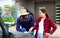 Young girl farmer buying trays with seedlings