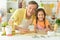 Young girl with father baking in the kitchen