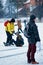 Young girl and fellow at the winter rink in Trakai