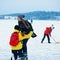 Young girl and fellow at winter rink in Trakai