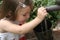 Young girl filling bucket