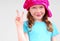 Young girl flashing peace sign