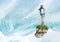 Young Girl on floating rock platform in sky with binoculars with interface