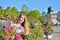 A young girl at the flower beds on the background of the monument bronze Horseman in Saint-Petersburg