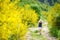 Young girl following a footpath around La Verna Sanctuary, Chiusi della Verna, in Casentino secular forest, one of the largest