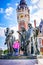 young girl in front of the public gardens of Calais with her famous sculpture of the six bourgeois of Calais