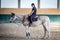 Young girl  gallops on the white horse.