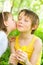 Young girl gives her brother a kiss on the cheek